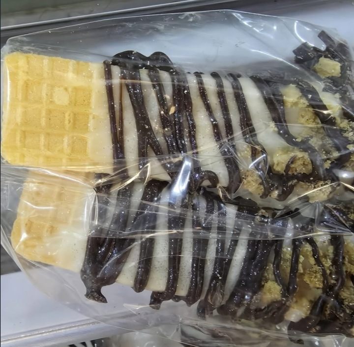 Drizzled wafer treats with cookie crumble