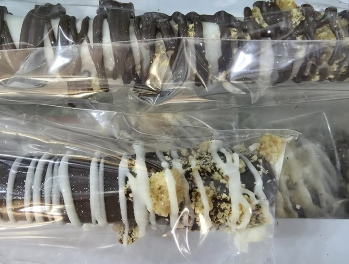 Chocolate-drizzled pretzel sticks, individually wrapped