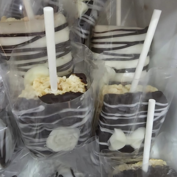 Chocolate-coated Rice Krispie treats on sticks